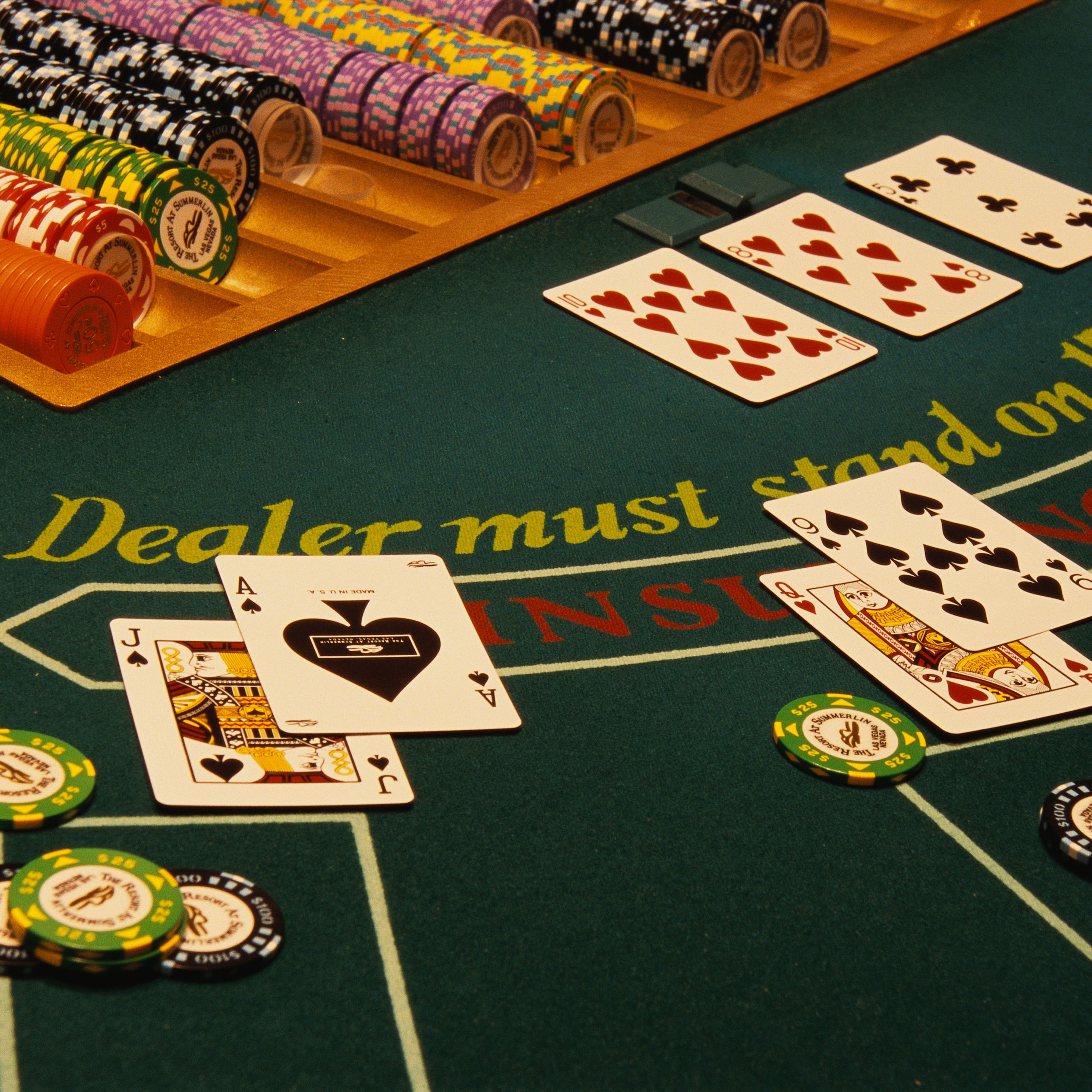 winning-blackjack-hand-on-casino-table-520257696-58979c263df78caebc19a6e7.jpg